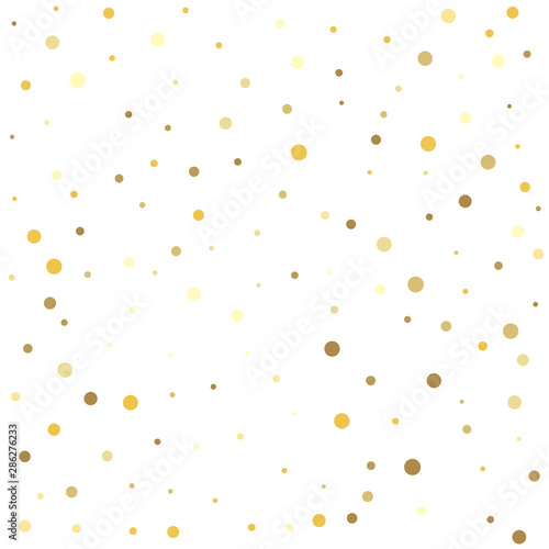 Gold dots on a white background. Texture of gold foil.