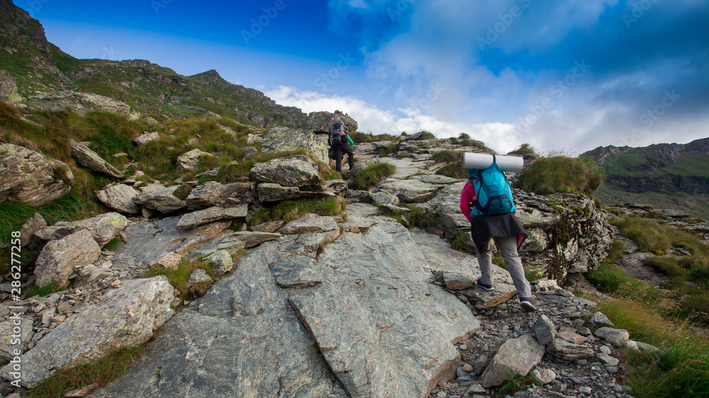 people climbing the mountain landscape