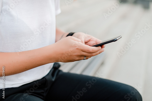 female hands hold phone
