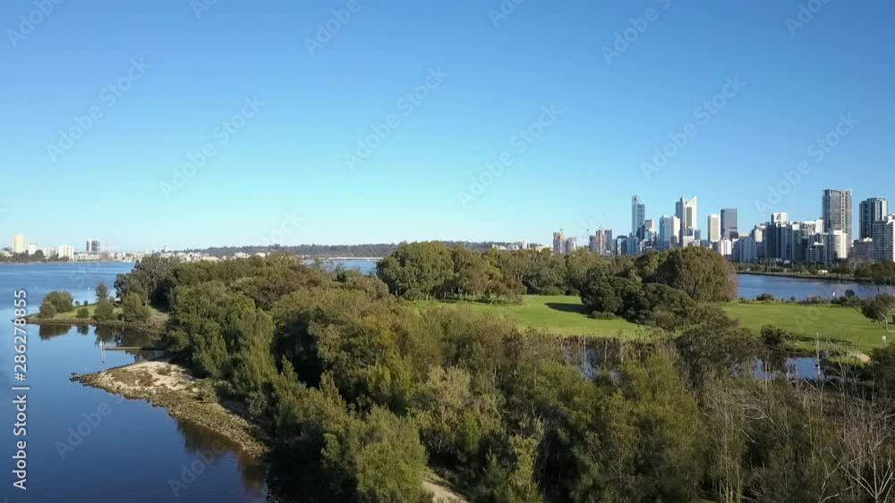 Beautiful scenic aerial view of flight above Heirisson Island and Swan River, with skyline of Perth, capital of Western Australia, blue sky and horizon as background. Beautiful scenic aerial view of flight above Heirisson Island and Swan River, with skyline of Perth, capital of Western Australia, blue sky and horizon as background.