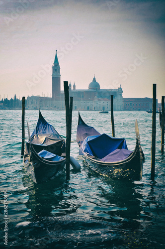 Gondola boats on canals in Venice Italy © supertramp8