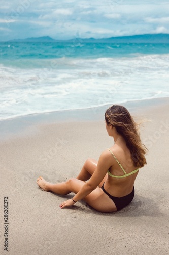 woman on the beach sitting