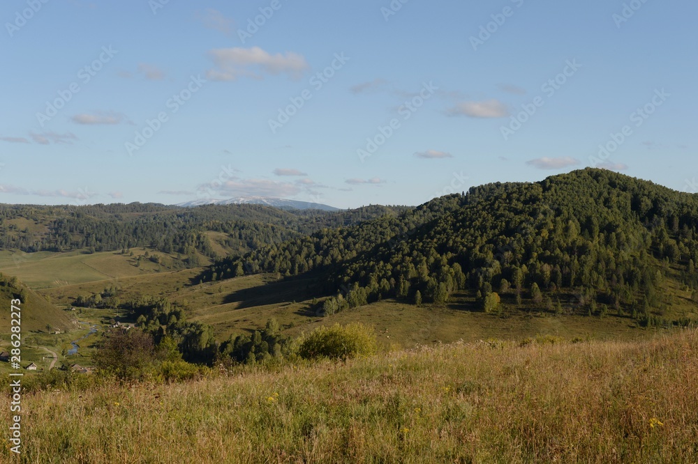 Landscape in the vicinity of the taiga village Generalka in the mountains of the Altai territory. Western Siberia. Russia Landscape in the vicinity of the taiga village Generalka in the mountains of the Altai territory. Western Siberia. Russia