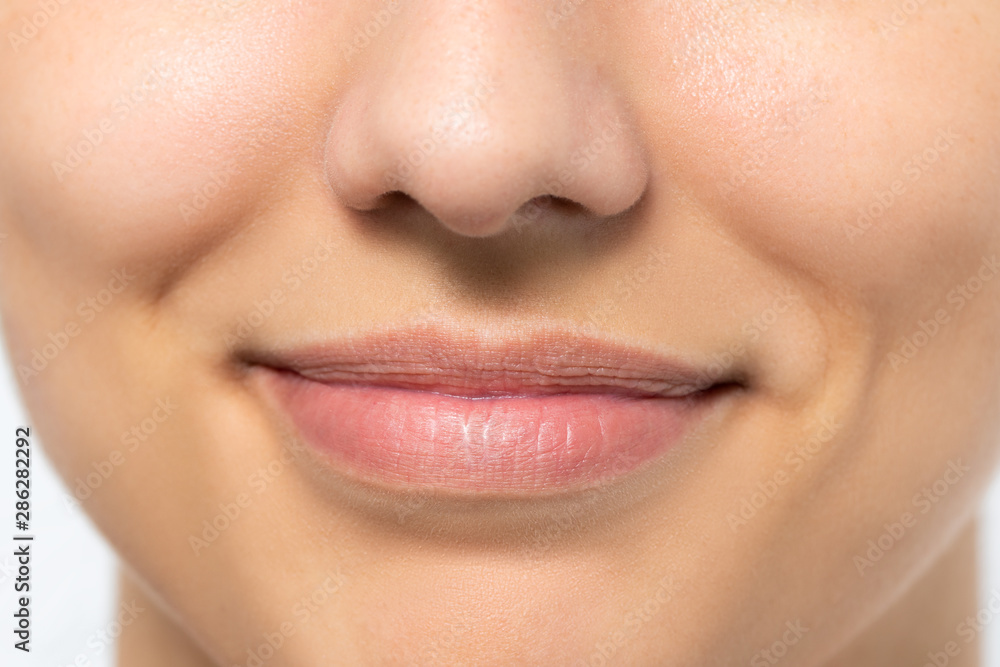 Obraz premium Macro detail of woman with charming smile.