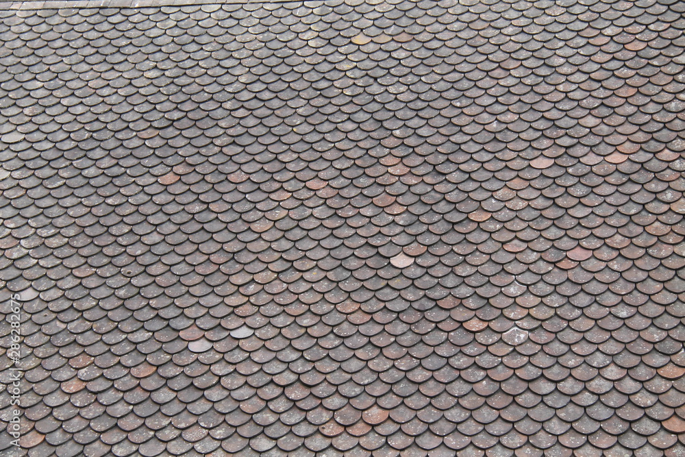 A Fish Scale Design Slate Tiles House Roof.