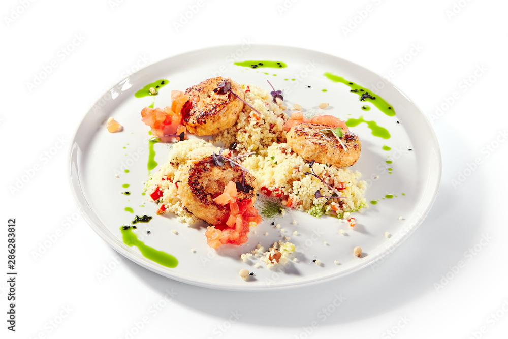 Turkey Meat Cutlets with Couscous Garnish on White Plate Isolated Turkey Meat Cutlets with Couscous Garnish on White Plate Isolated