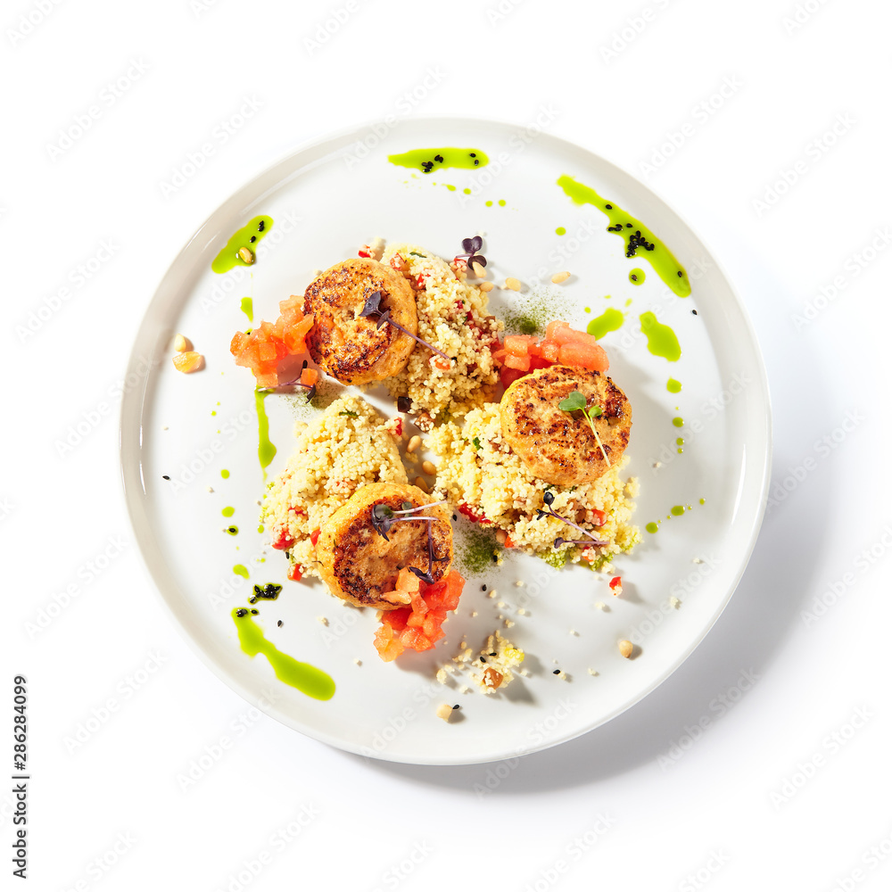 Turkey Meat Cutlets with Couscous Garnish on White Plate Isolated