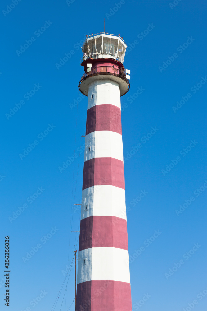 Evpatoria lighthouse against the blue sky in the village of Zaozernoye, Saki district, Crimea