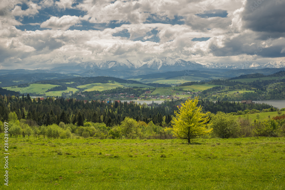 View on the Czorsztynskie lake and Tatra mountains from Czorsztyn, Pieniny, Poland