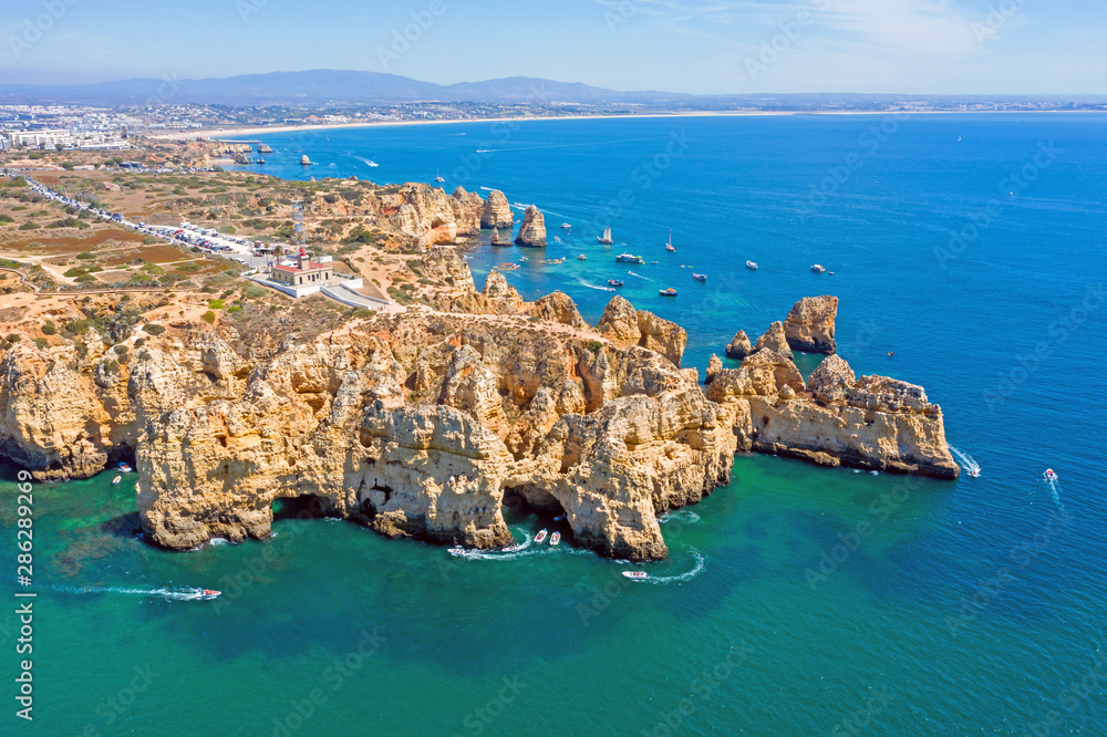 Aerial from natural rocks and the lighthouse at Ponte Piedade in Lagos Portugal