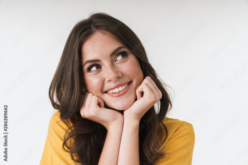 Image of gorgeous brunette woman wearing casual t-shirt smiling and propping up her head with hands Image of gorgeous brunette woman wearing casual t-shirt smiling and propping up her head with hands