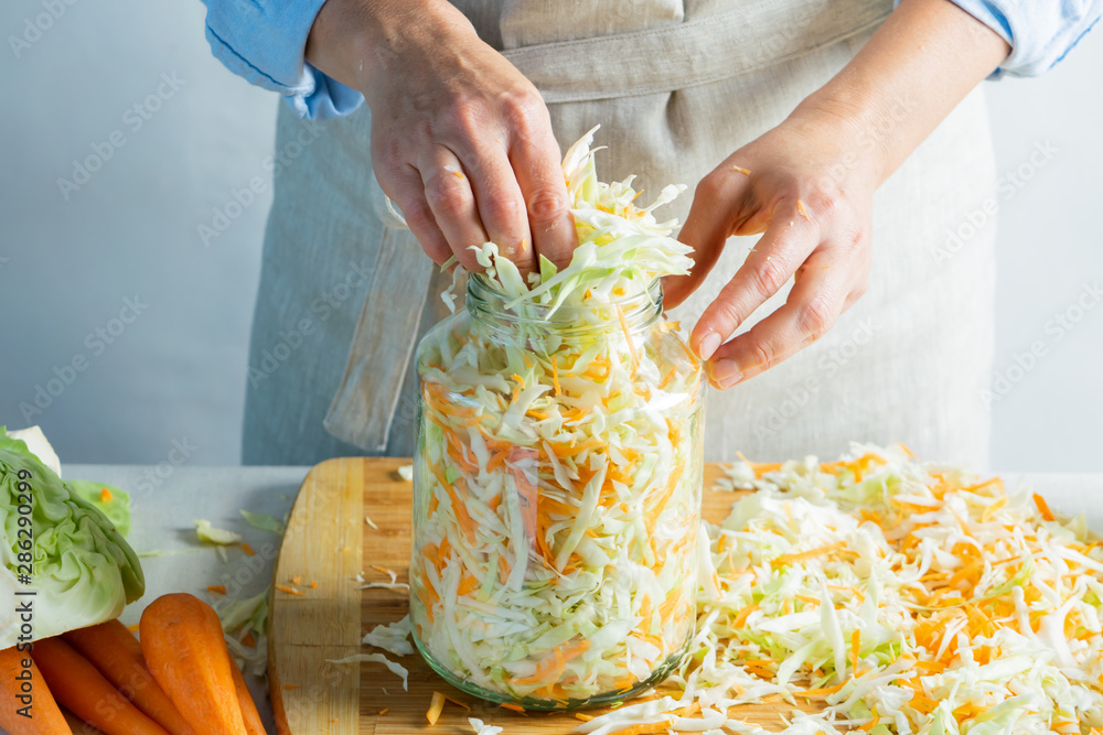 Ταπετσαρία The preparation process fermentation preservation Sauerkraut on a light background