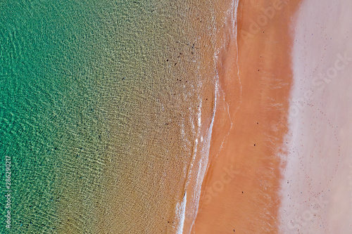 Aerial top shot from ocean waves at the beach