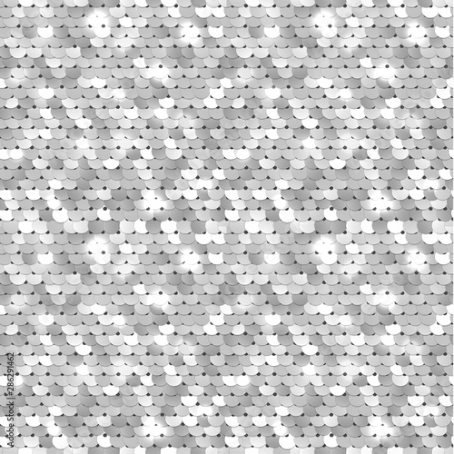 Seamless silver texture of fabric with sequins photo