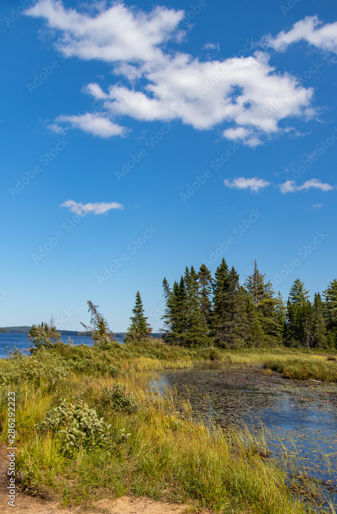 Clouds and blue sky over Hailstorm Creek in Algonquin Provincial Park