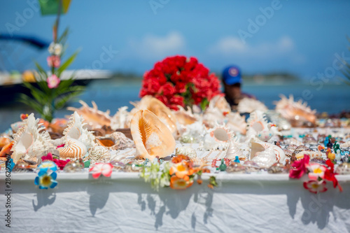 Floating table shop with souvenirs for tourists to buy in Indian ocean in Mauritius
