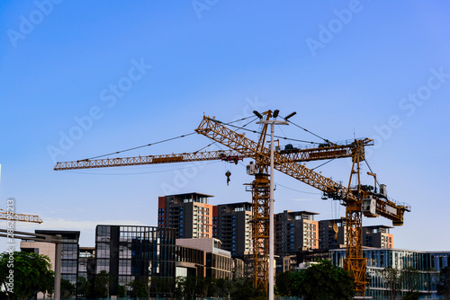 cranes visually crossed at a residential complex construction site in shenzhen, china