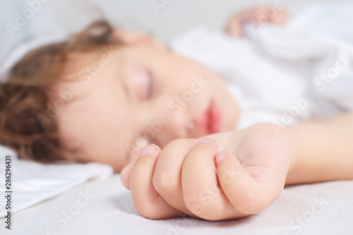 little girl sleeps in bed. Baby sleep concept. Selective focus.