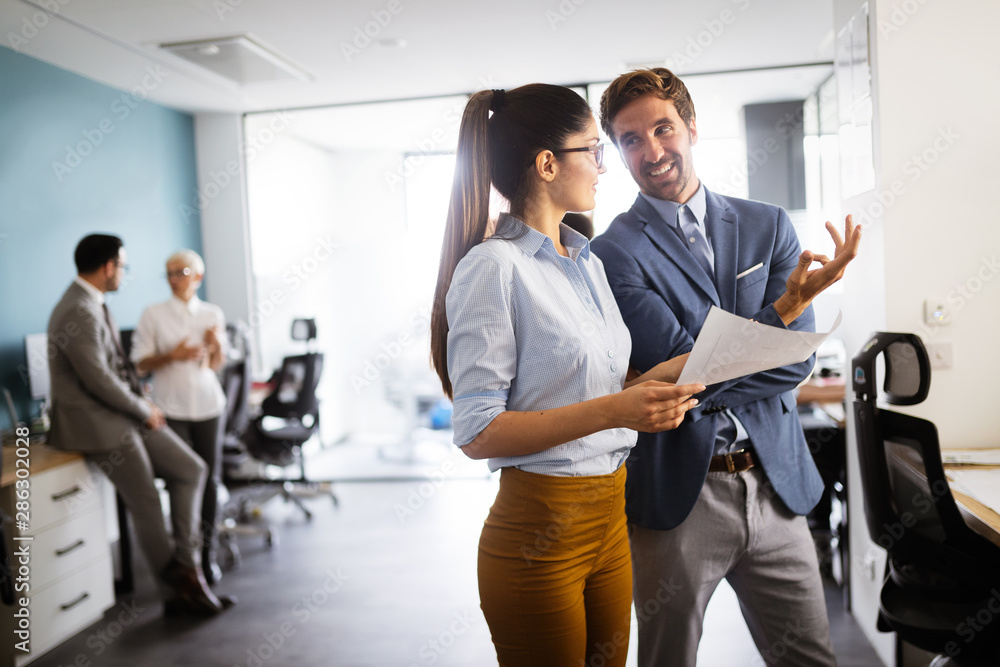 Group of successful business people at work in office Group of successful business people at work in office