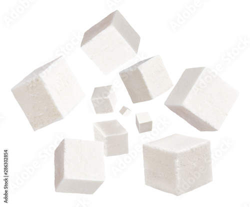Falling cubes of soft cheese isolated on white background. Feta