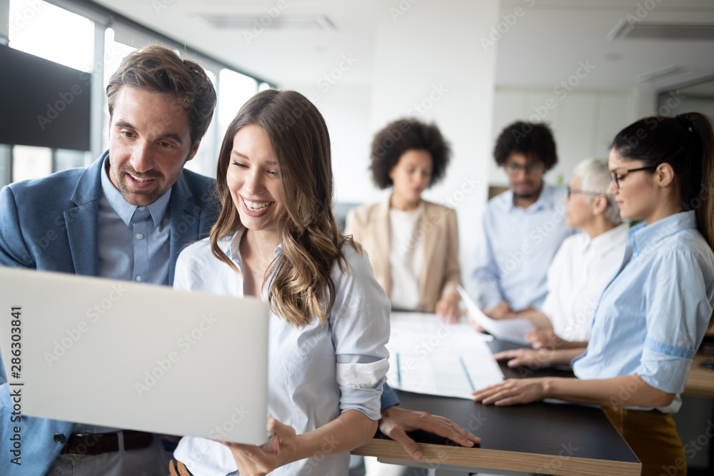 Business people working and brainstorming in office