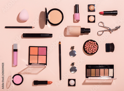 Top view of different makeup products for woman face care