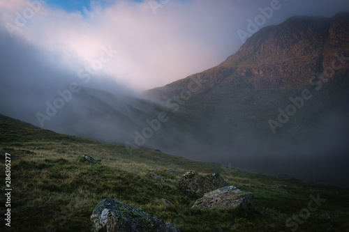 Cloud rolling in across a lake photo