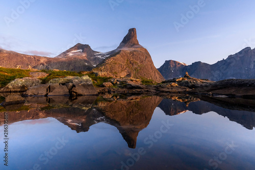 Reflection of the Romsdal Horn in a small lake.