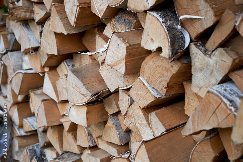 Abstract photo of a pile of natural wooden logs background Abstract photo of a pile of natural wooden logs background