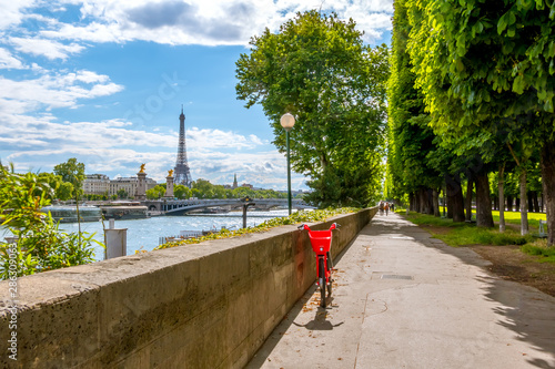 Photography Red Bike on the Sunny Promenade of the River Seine