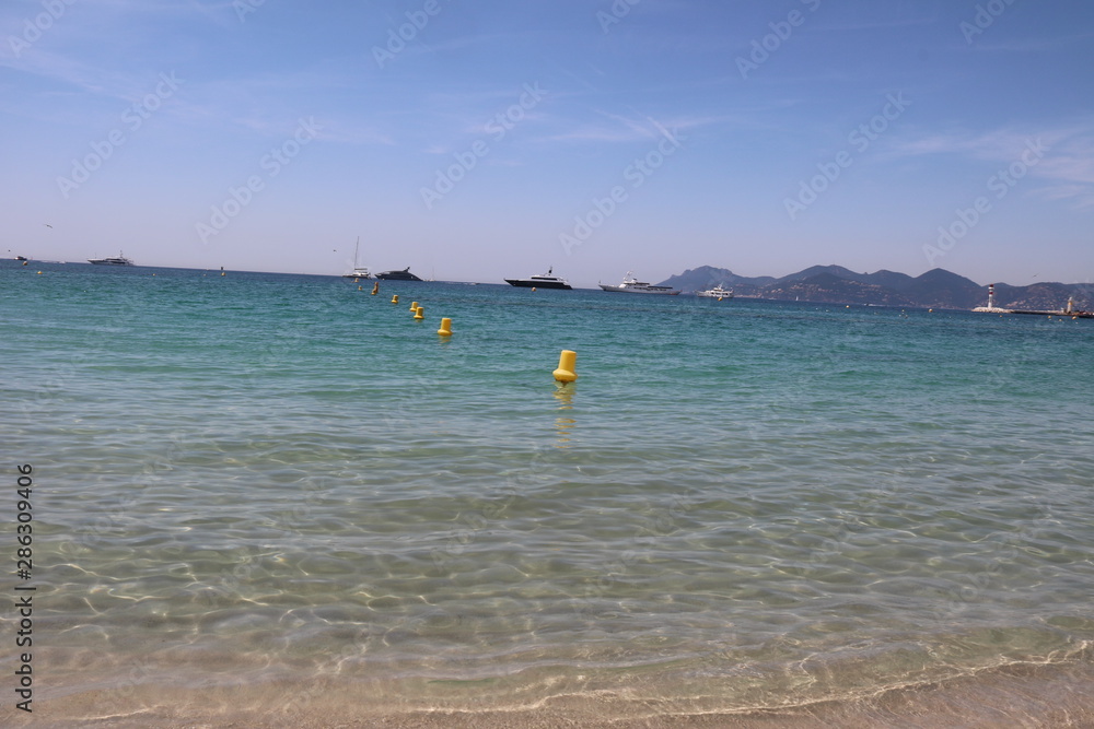 Beach in Cannes with yachts