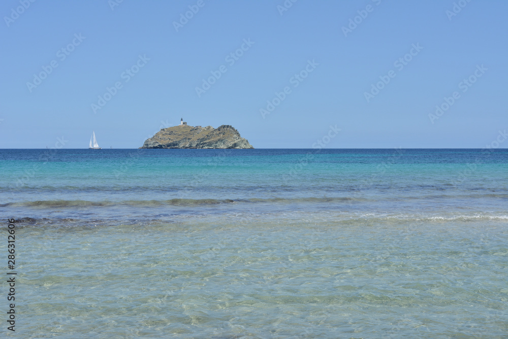 Barcaggio beach and Giraglia island. Cap Corse, Corsica, France