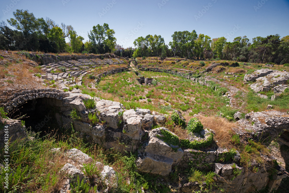 Panoramic view of the Roman amphitheater of Syracuse, in Sicily Italy.
