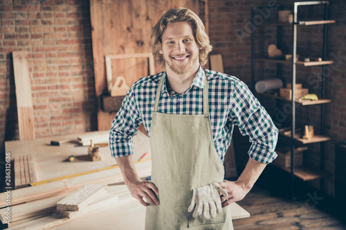 Portrait of his he nice attractive handsome bearded blond cheerful cheery content successful guy artisan builder at industrial brick loft style interior indoors workplace