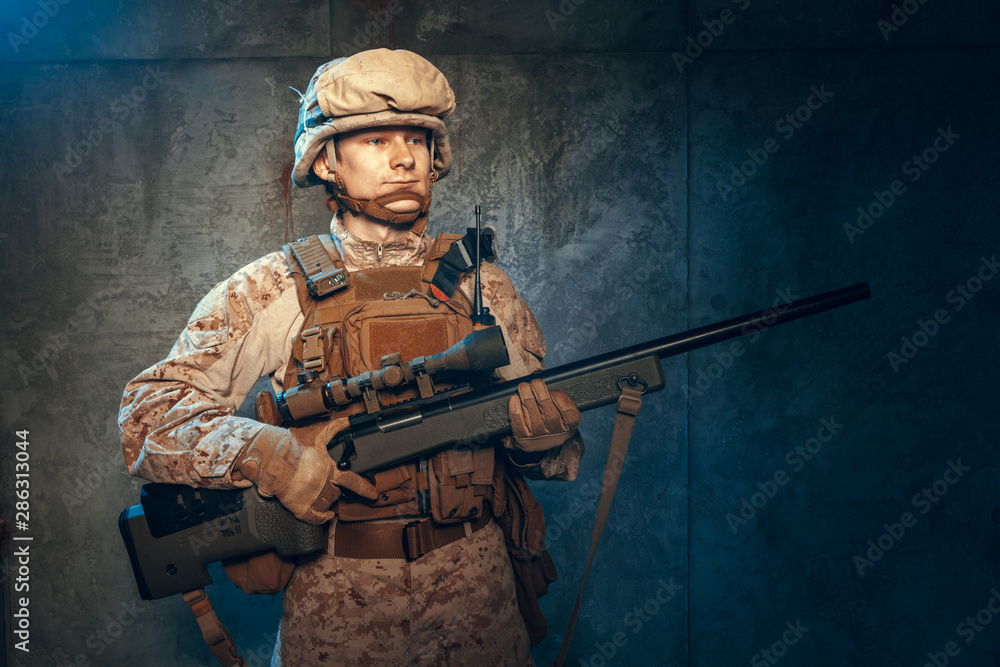 War, army, weapon concept. Private military contractor holding rifle War, army, weapon concept. Private military contractor holding rifle