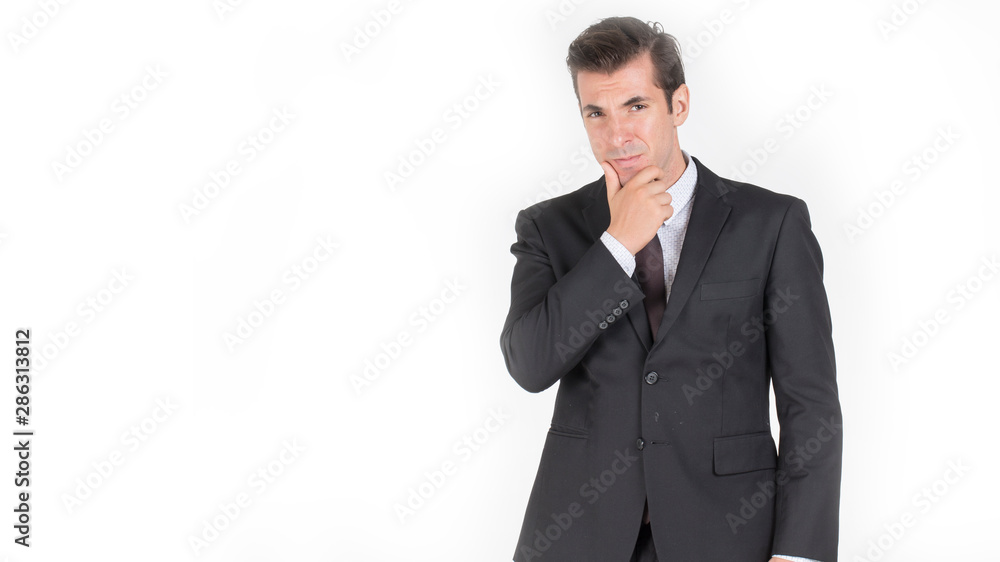 Handsome business man standing thinking and so smart and successful Handsome business man standing thinking and so smart and successful