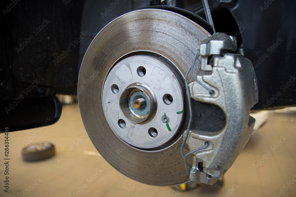 The braking system of a modern car. Brake Disc. Brake Caliper. Close-up.