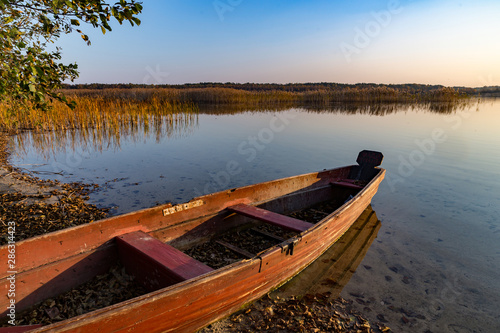 old wooden boat on lake