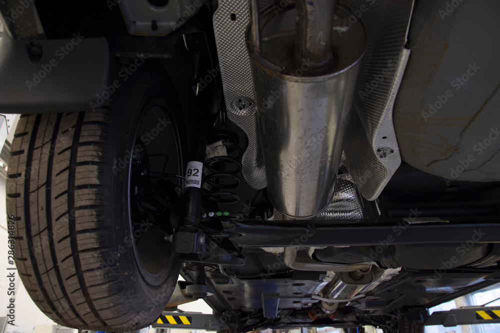 custom made wallpaper toronto digitalThe car on the lift bottom view. Details of the rear suspension and exhaust system.