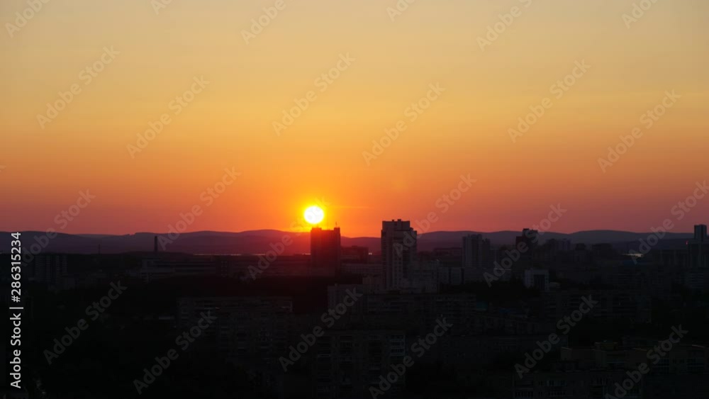 Sunset timelapse clouds colorful and building b Sunset timelapse clouds colorful and building b