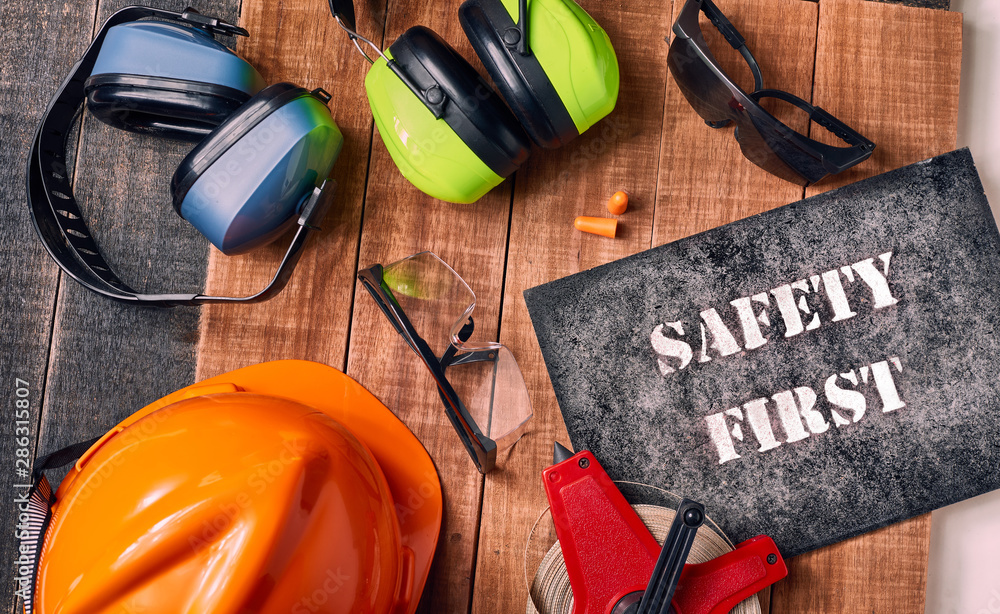 Safety first sign with personal protective equipment Stock Photo ...
