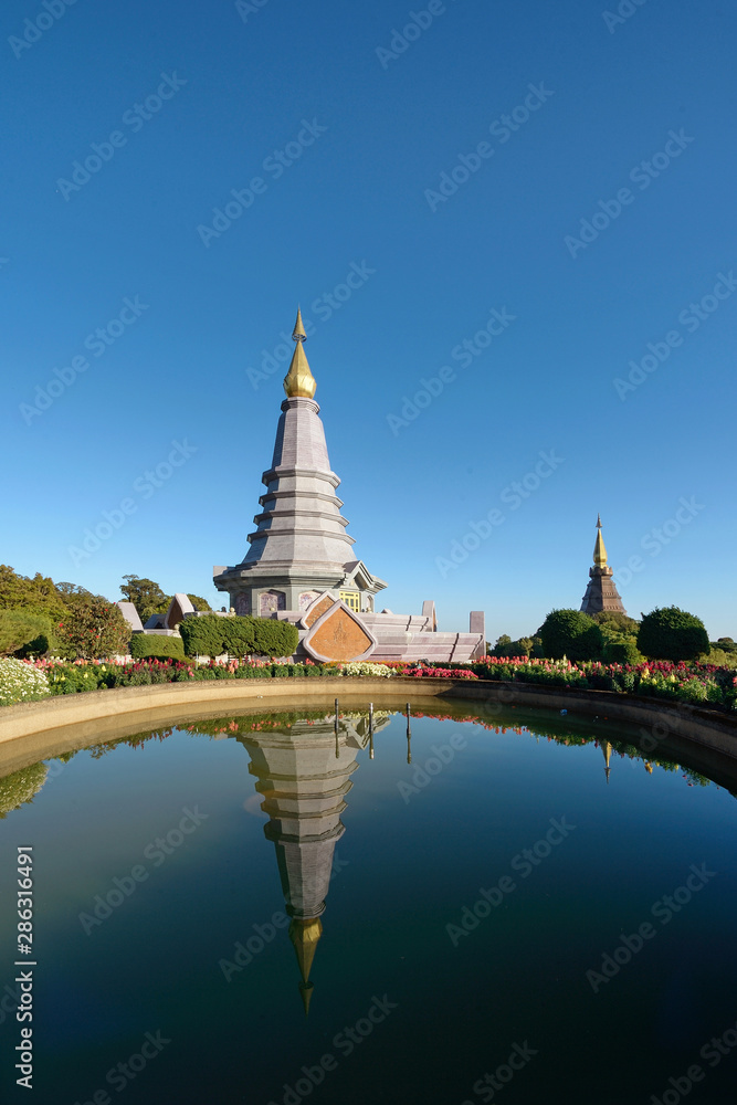 The pagoda on the top of Doi Inthanon reflects the water.