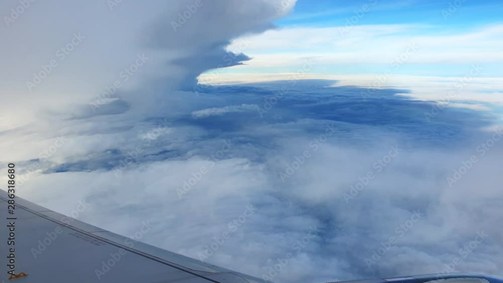 Cloud skyscape over plane window Cloud skyscape over plane window