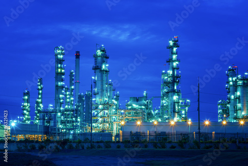 Industrial view Oil refinery and oil tanks plant during at blue sky photo