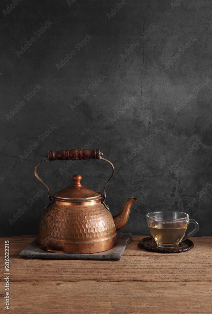 Group of arabic tea in glass and metal tea pot,Tea set with a blank space for a text Group of arabic tea in glass and metal tea pot,Tea set with a blank space for a text