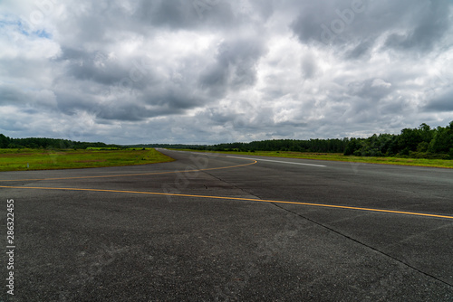 Runway and Cloudy Sky