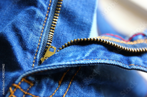 man,woman blue jeans zipper open