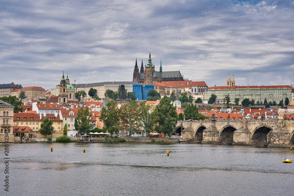 Old Town pier architecture and Charles Bridge over Vltava river