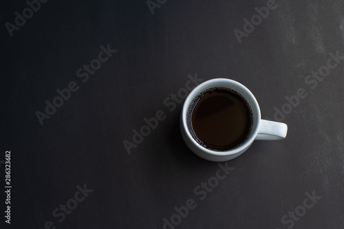 cup of coffee on black background. soft focus.