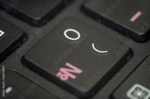 Close up of the round bracket and zero key on a keyboard